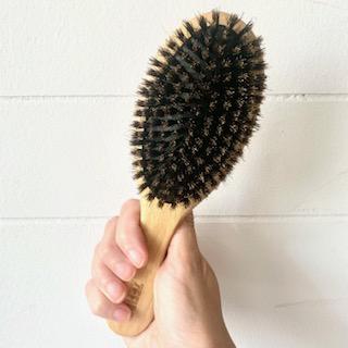 Bamboo and natural boar bristle plastic free hair brush for all types of a hair. 